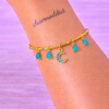 BCF364DF-4470-4ED7-9F37-A9459CD422EB Bracelet Doré Charms Lune & Pierres Bleues