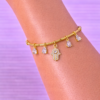 FBC70A29-F854-412E-953A-5188D71823D1 Bracelet Doré Charms Main Protectrice & Cristaux Transparents